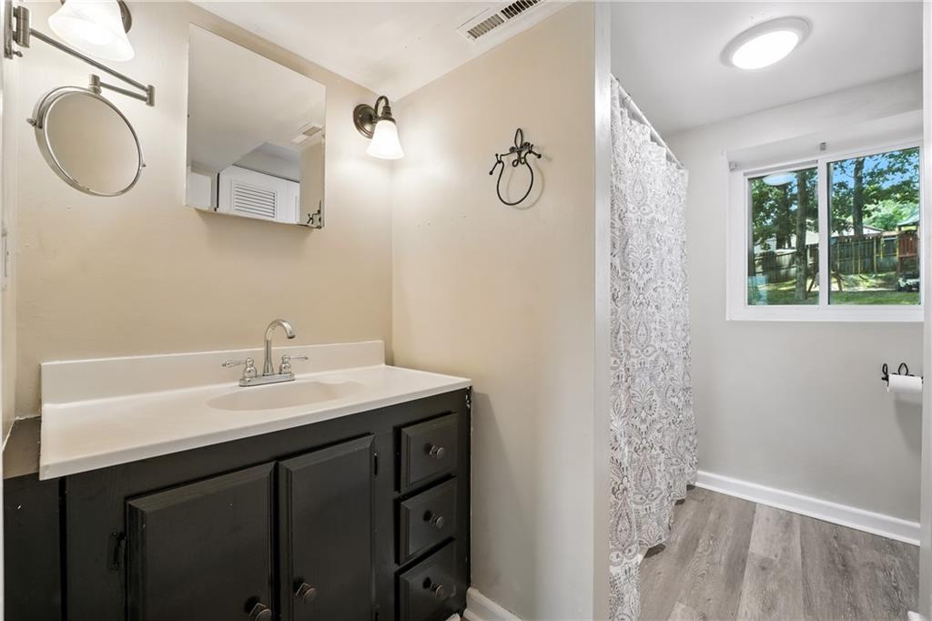 2066 Powell Road Cranberry Township, PA 16066 - Photo 29 of 44 a bathroom with a sink vanity granite toilet and a mirror