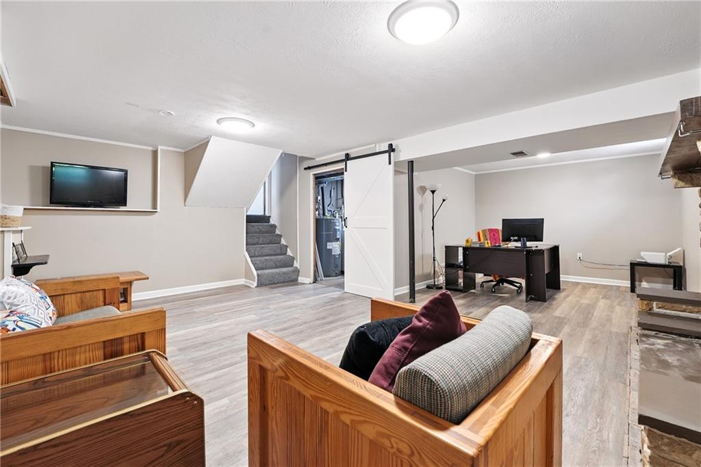 2066 Powell Road Cranberry Township, PA 16066 - Photo 32 of 44 a living room with furniture and a flat screen tv