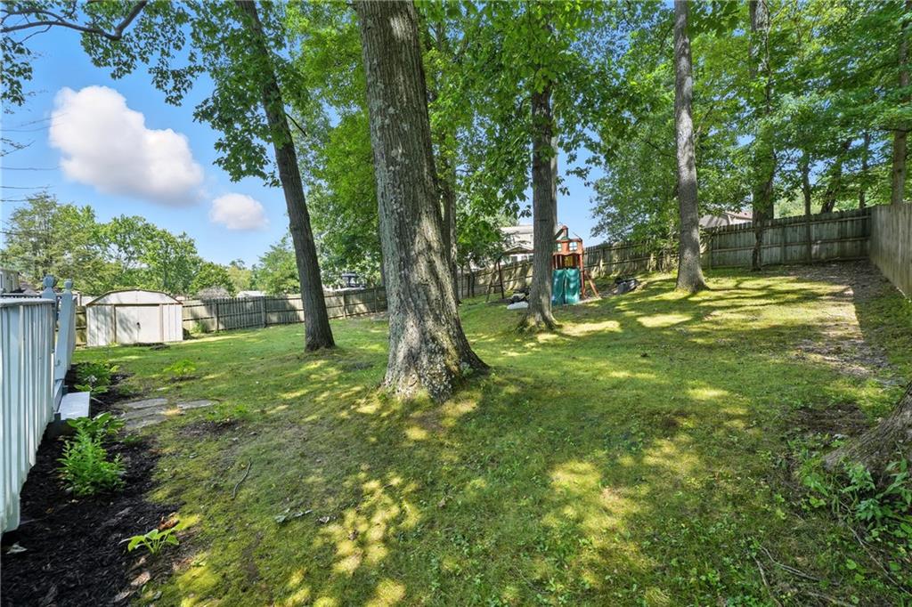 2066 Powell Road Cranberry Township, PA 16066 - Photo 37 of 44 a backyard of a house with lots of green space