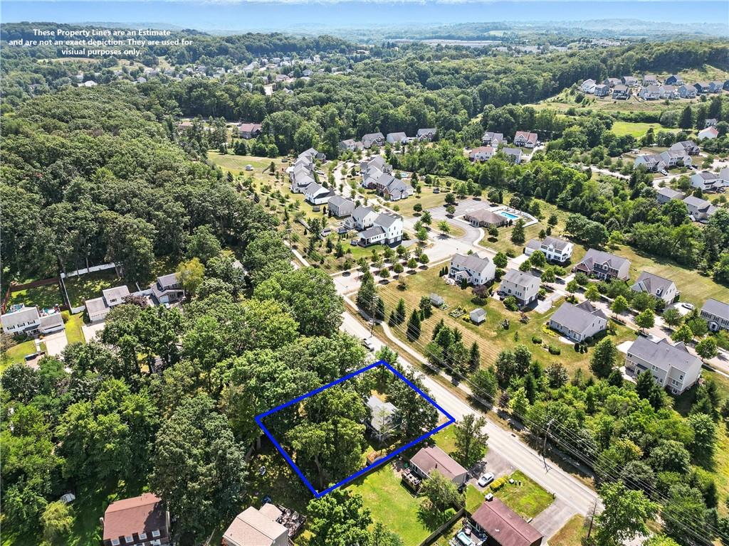 2066 Powell Road Cranberry Township, PA 16066 - Photo 40 of 44 an aerial view of a city with lots of residential buildings