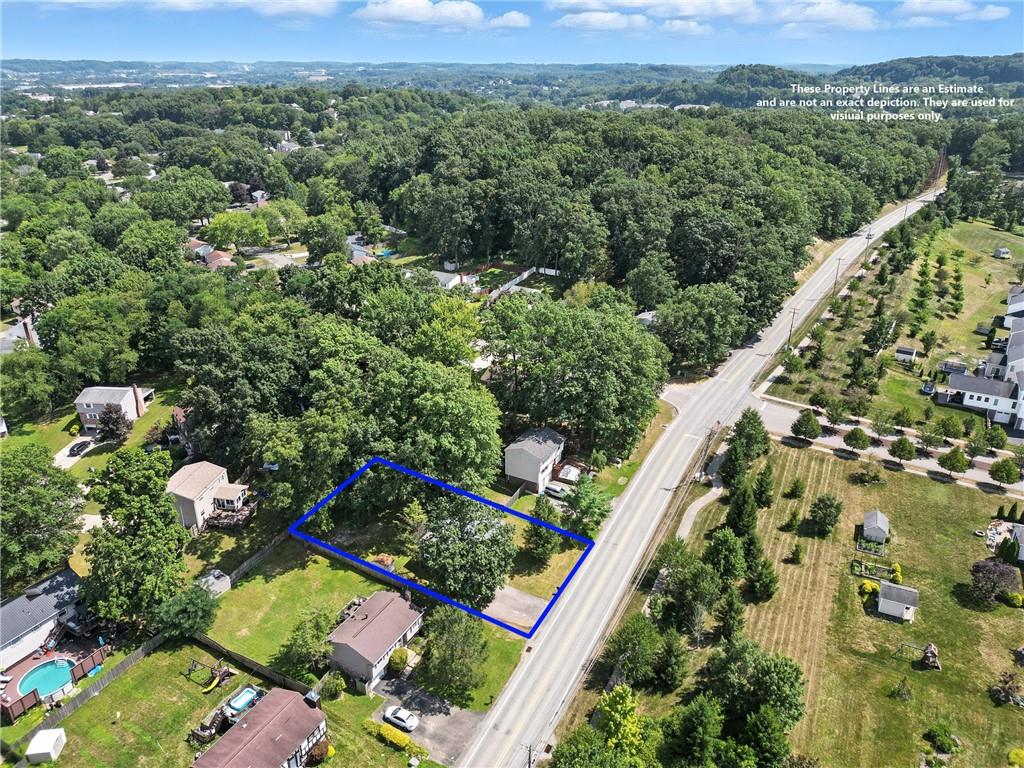2066 Powell Road Cranberry Township, PA 16066 - Photo 41 of 44 an aerial view of green landscape with trees houses and mountain view
