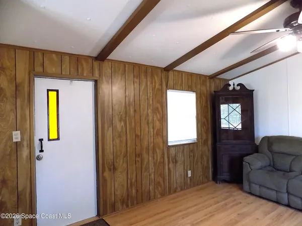 a view of livingroom with furniture and windows