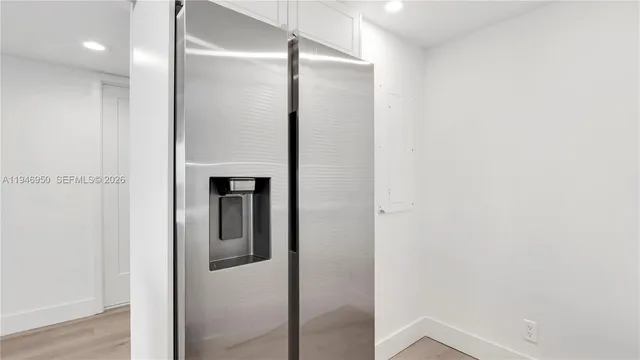 a bathroom with a shower and a mirror