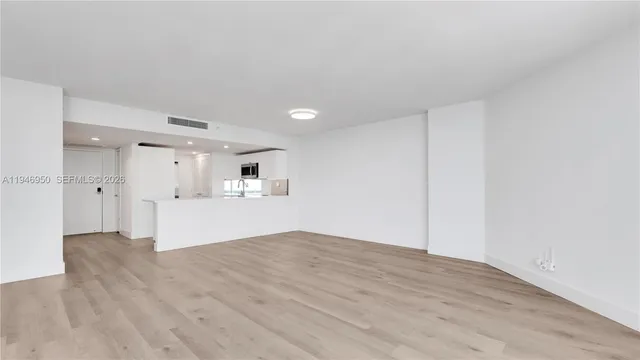 a view of kitchen with wooden floor