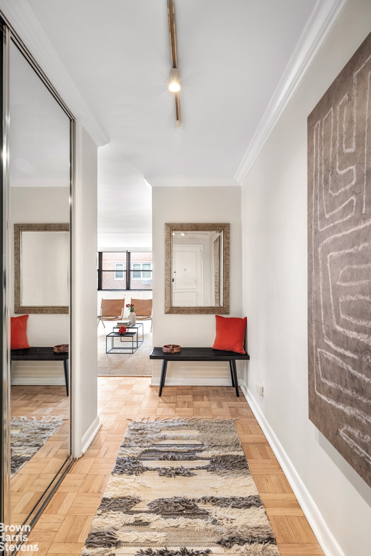 239 East 79th Street, Unit 12P Manhattan, NY 10075 - Photo 2 of 9 a room with lots of furniture and a rug