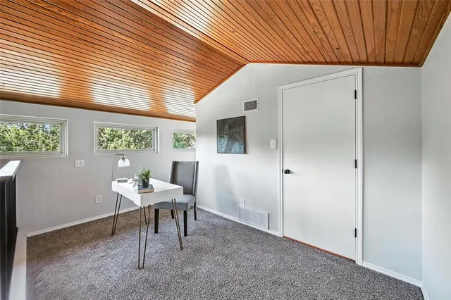 a workspace with furniture and a window