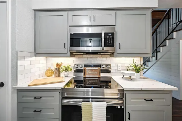 a kitchen with a stove and a microwave
