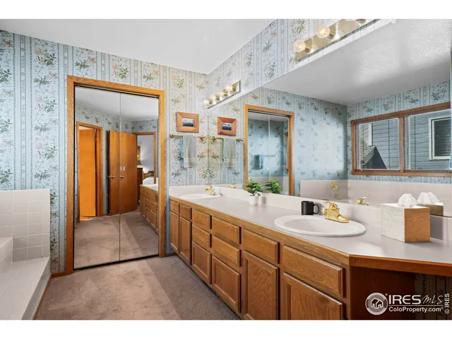 a bathroom with a sink a mirror and a bathtub