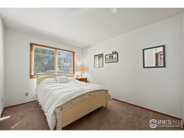 a living room with a couch and a window