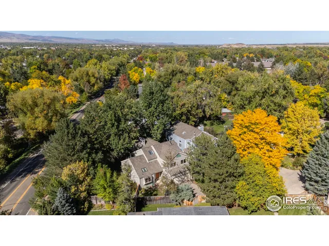 a view of a street with a building in the background