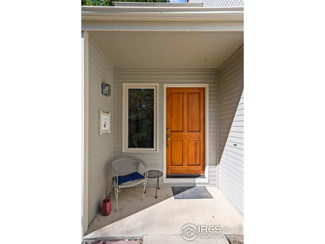 a living room with a couch and a window