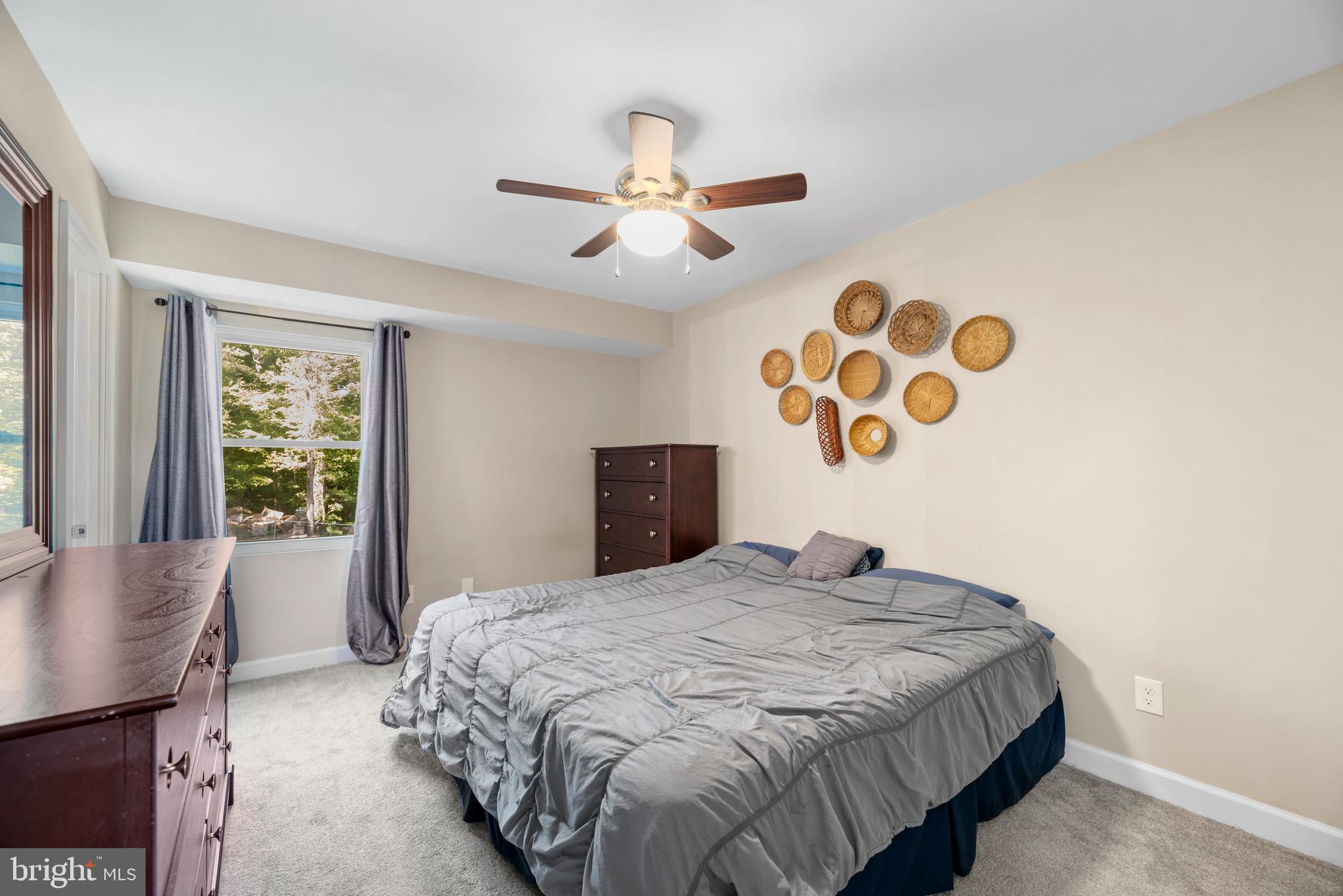 5756 Stephen Reid Road Huntingtown, MD 20639 - Photo 27 of 42 a bedroom with a large bed and a window