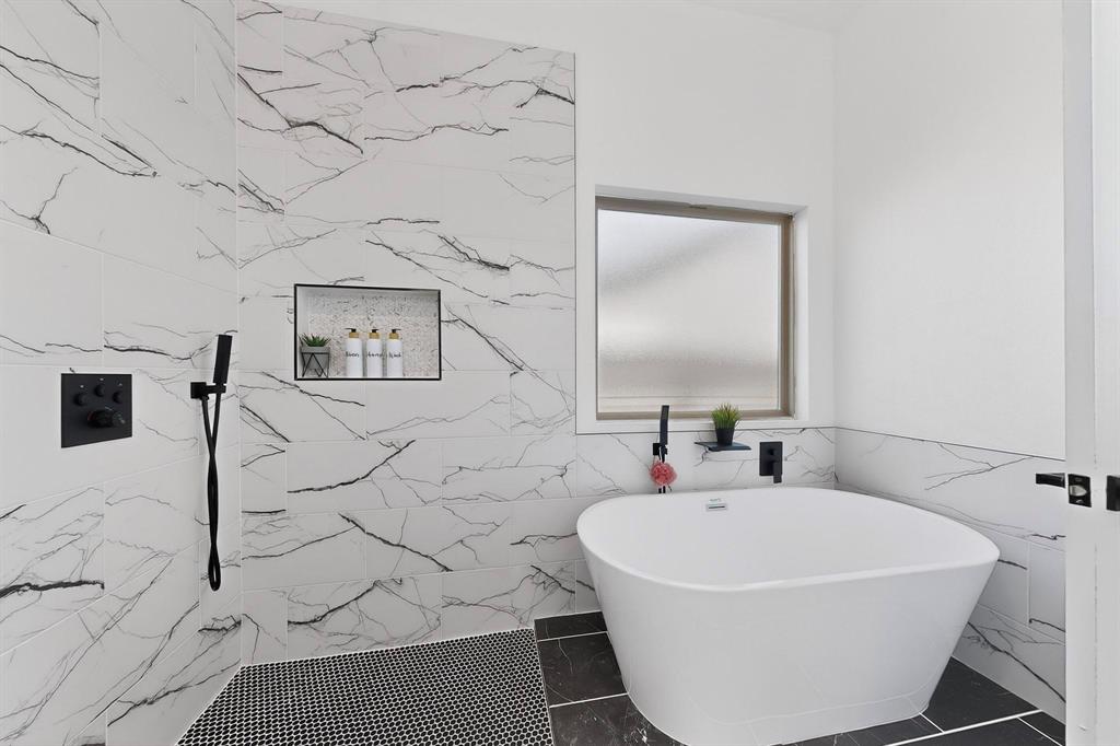 4464 Key Ranch Road Trinidad, TX 75163 - Photo 21 of 40 Bathroom featuring a freestanding tub, tile walls, and a marble finish shower