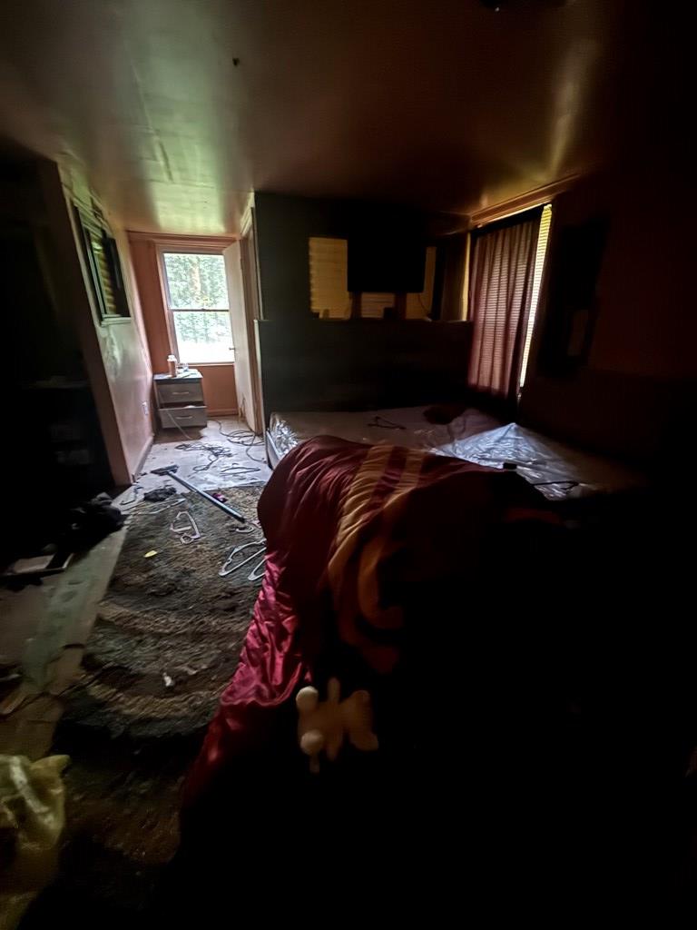 3909 Commander Drive Columbus, GA 31903 - Photo 20 of 21 a bed sitting in a bedroom next to a window