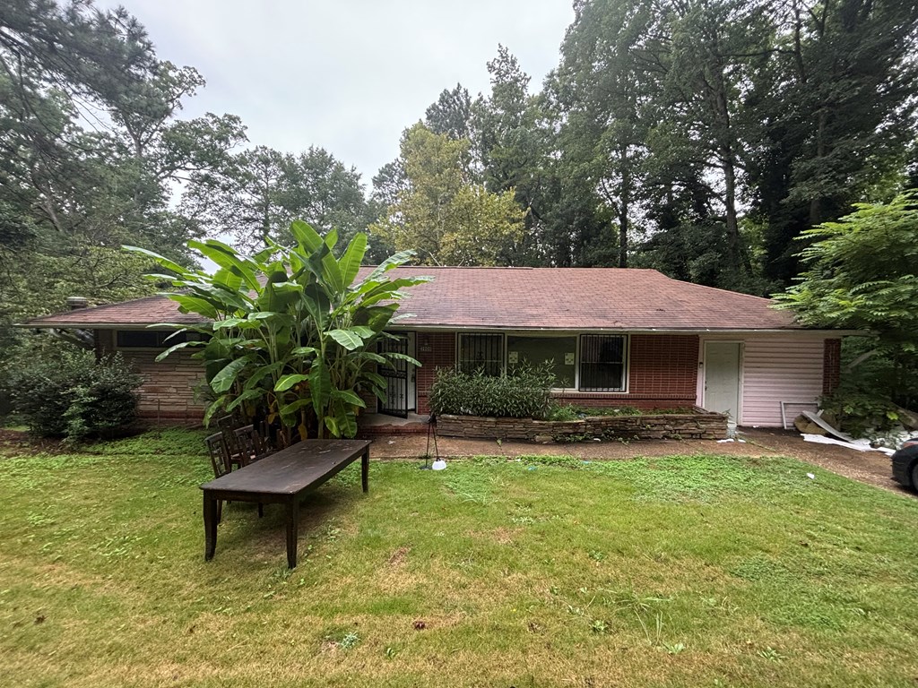 3909 Commander Drive Columbus, GA 31903 - Photo 2 of 21 a backyard of a house with table and chairs