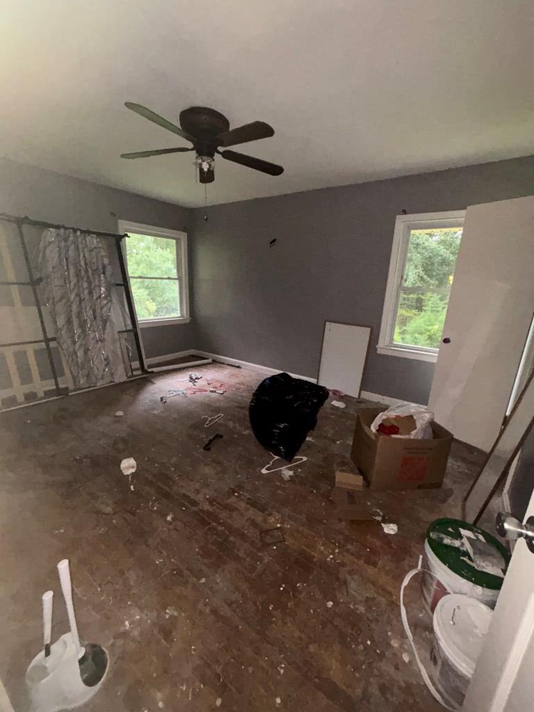 3909 Commander Drive Columbus, GA 31903 - Photo 7 of 21 a bedroom with a bed and a chandelier