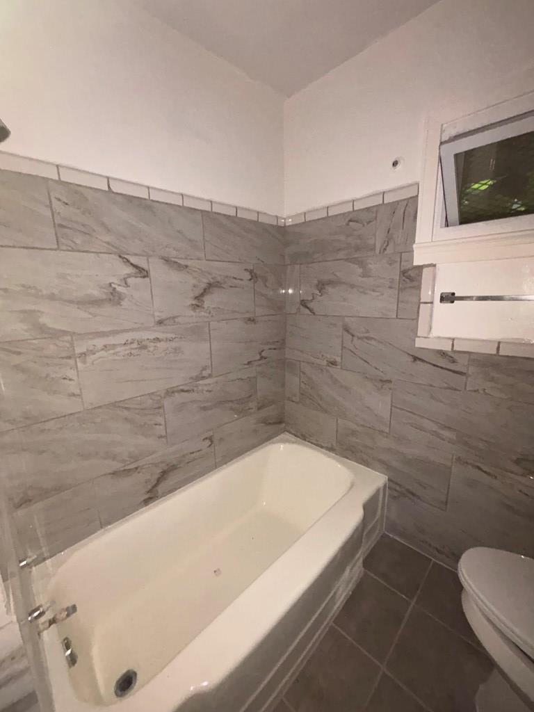 3909 Commander Drive Columbus, GA 31903 - Photo 10 of 21 a bathroom with a bathtub and toilet