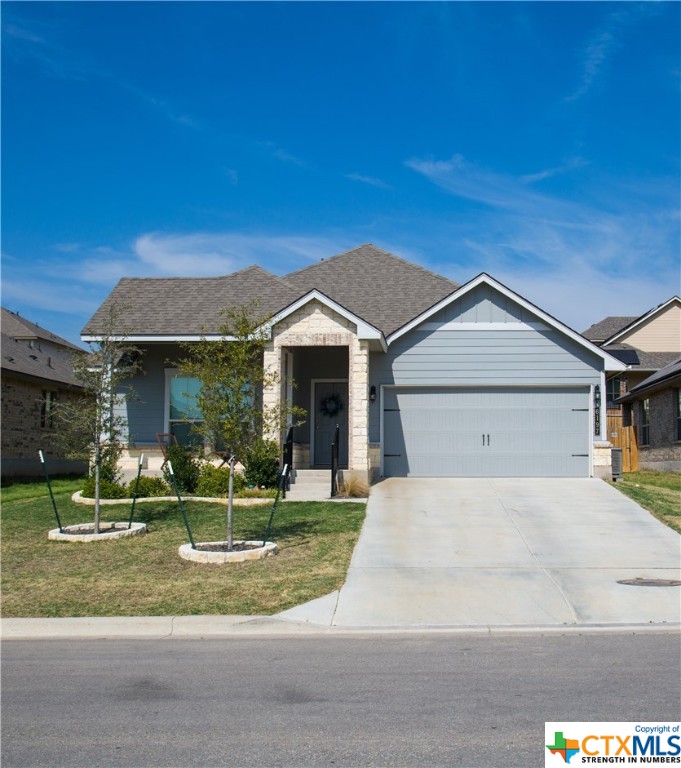 6197 Lavaca Drive Belton, TX 76513 - Photo 1 of 1 a front view of a house with a yard and garage