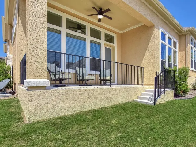 a view of an apartment with a backyard