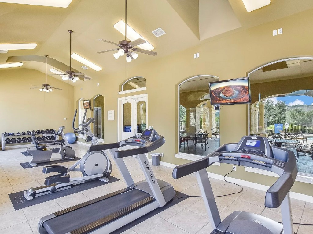 106 Evolutions Path Austin, TX 78738 - Photo 19 of 24 a view of a dining room with furniture wooden floor and chandelier