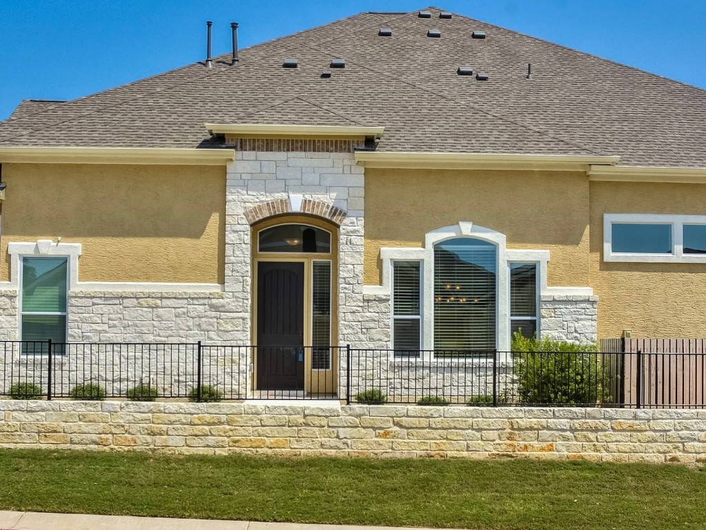 106 Evolutions Path Austin, TX 78738 - Photo 2 of 24 a front view of a house with a yard