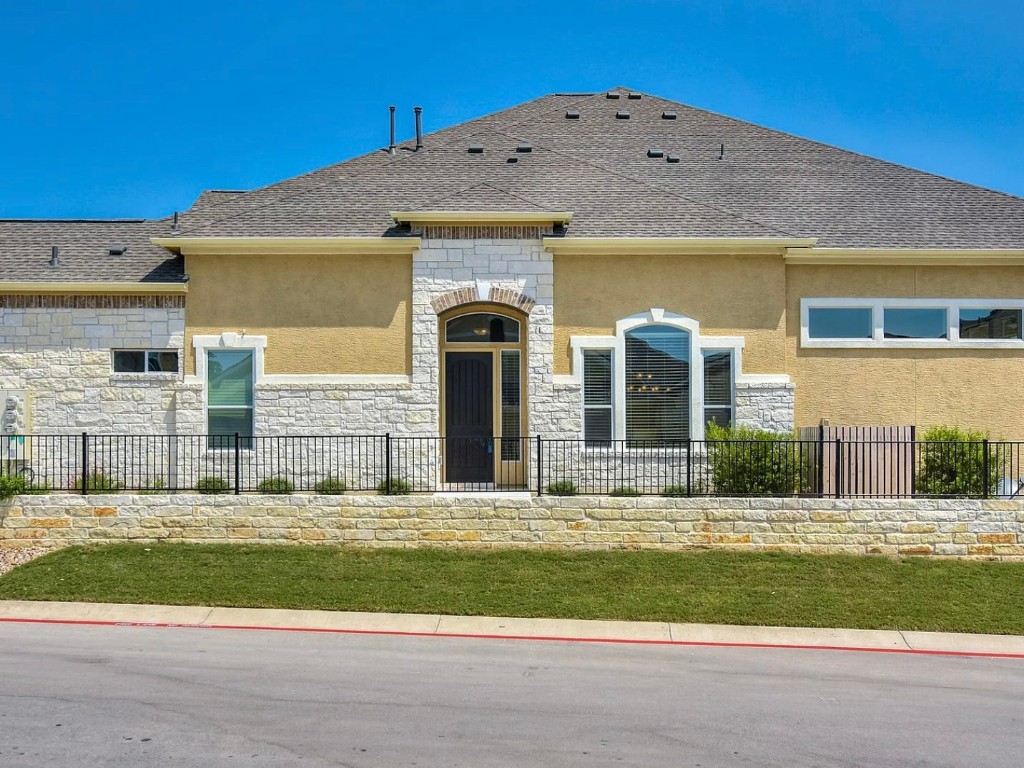 106 Evolutions Path Austin, TX 78738 - Photo 3 of 24 a view of a house with a swimming pool