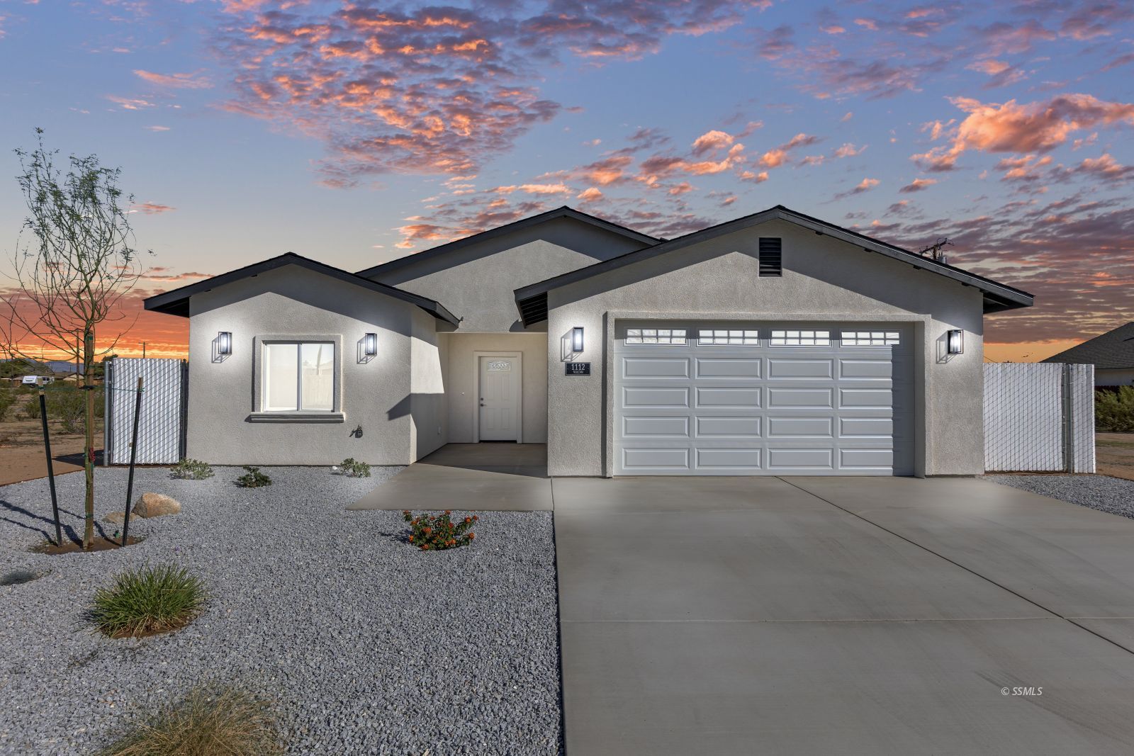 1112 Vulcan Ridgecrest, CA 93555 - Photo 1 of 30 a front view of a house with a yard and garage