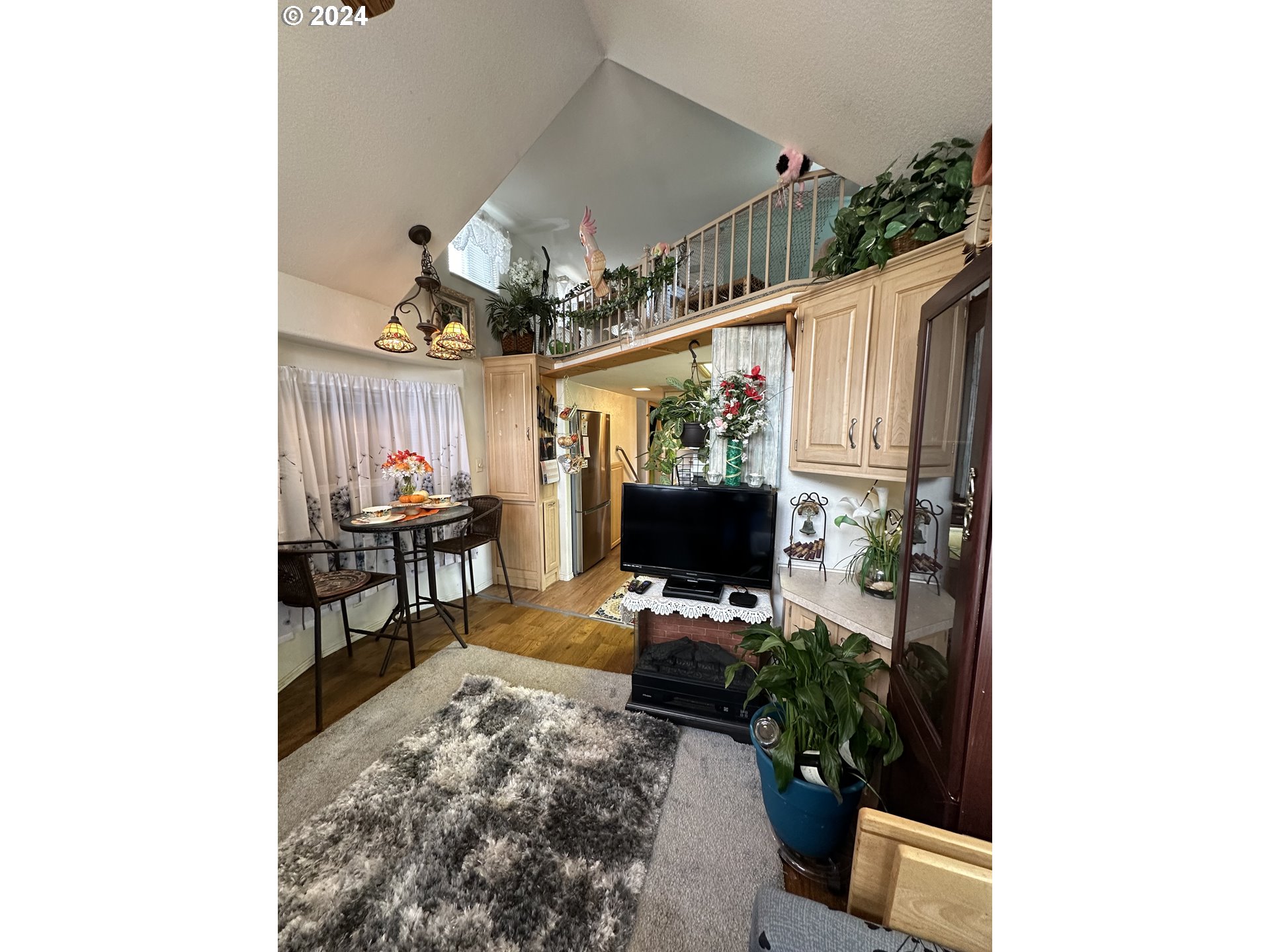 28800 Salmon River Highway Grand Ronde, OR 97347 - Photo 13 of 37 a room with furniture and a flat screen tv