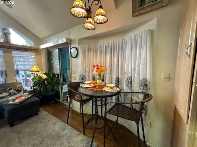a view of a dining room and hall with furniture