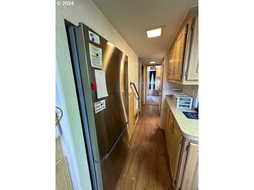 28800 Salmon River Highway Grand Ronde, OR 97347 - Photo 8 of 37 a view of a hallway with wooden floor