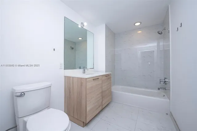a close view of a utility room with dryer and washer