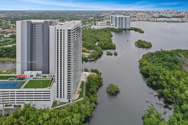 a view of an entryway with a floor to ceiling window and a living room