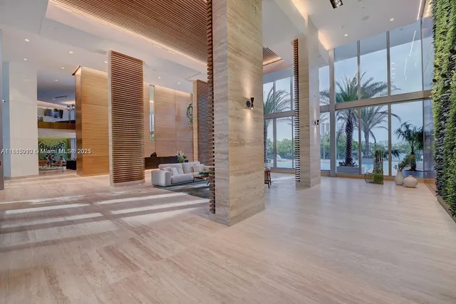 a building outdoor space with patio furniture and potted plants