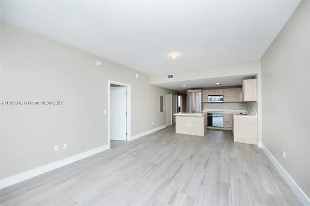 a kitchen with a sink stove and refrigerator