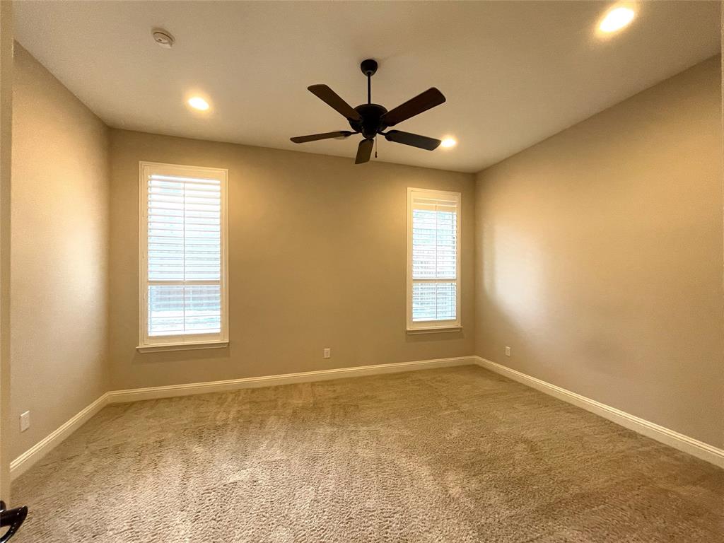 1840 Audubon Pond Way Allen, TX 75013 - Photo 20 of 38 a view of a livingroom with a window and a ceiling fan