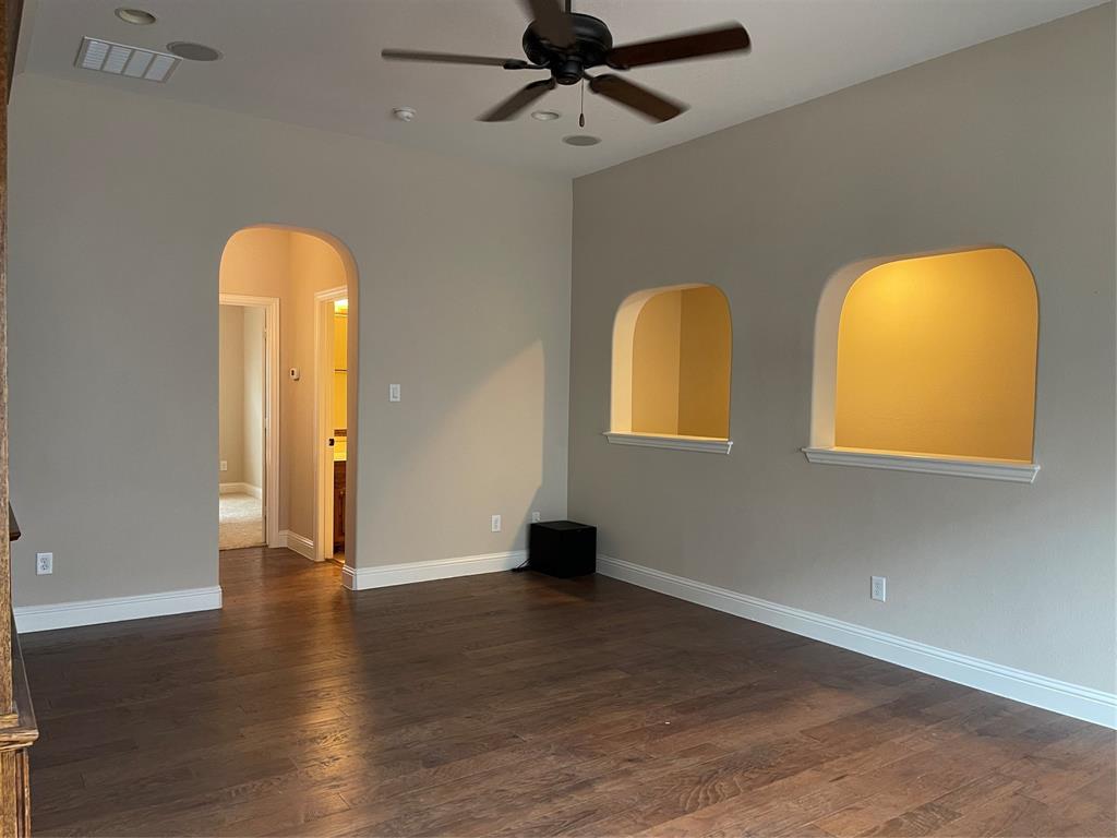 1840 Audubon Pond Way Allen, TX 75013 - Photo 29 of 38 a view of a room with wooden floor windows and a chandelier