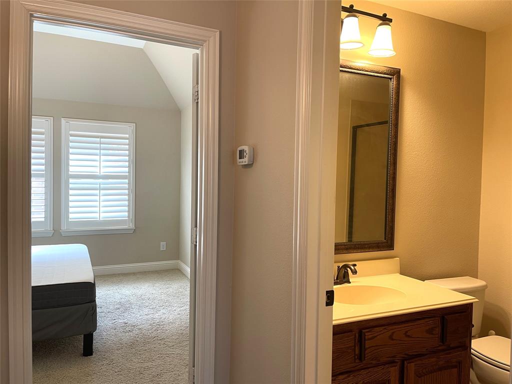 1840 Audubon Pond Way Allen, TX 75013 - Photo 30 of 38 a bathroom with a sink a toilet and a mirror