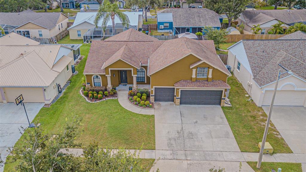 9809 La Rita Place Riverview, FL 33569 - Photo 58 of 59 an aerial view of multiple houses with yard