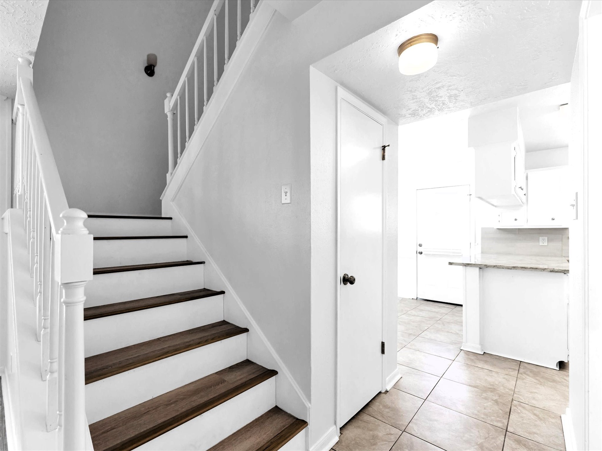 1101 Wilson Drive Rosenberg, TX 77471 - Photo 7 of 38 VIEW OF STAIRS WITH LVP & LOOKS TO DINING ROOM!