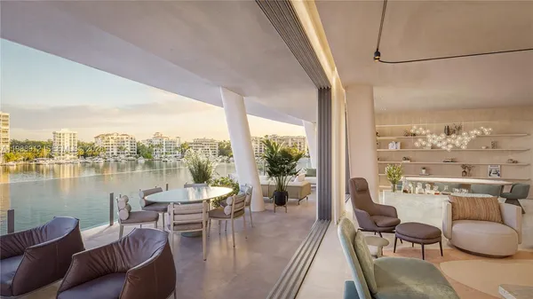 a living room with furniture a rug and a floor to ceiling window