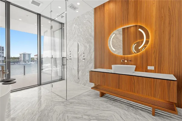 a living room with a couch and chandelier