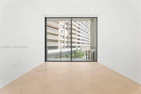 a view of a hallway with washer and dryer
