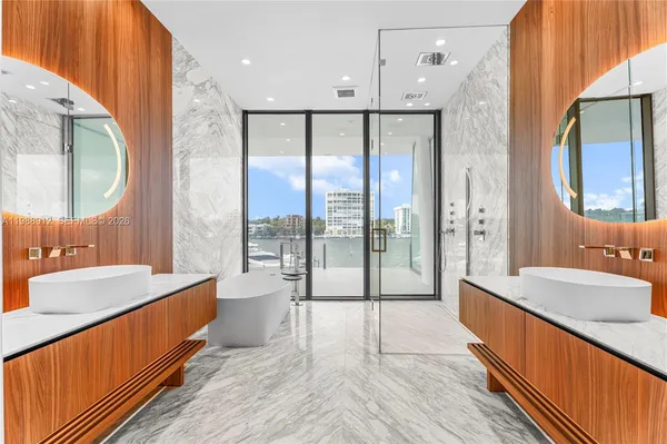 a large bathroom with a large tub and shower
