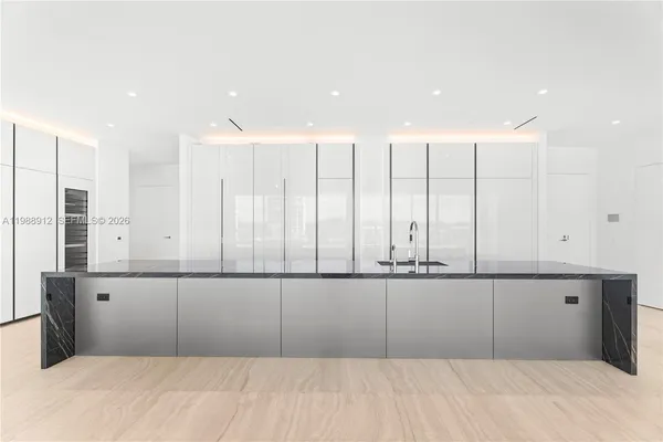 a view of an empty room with windows