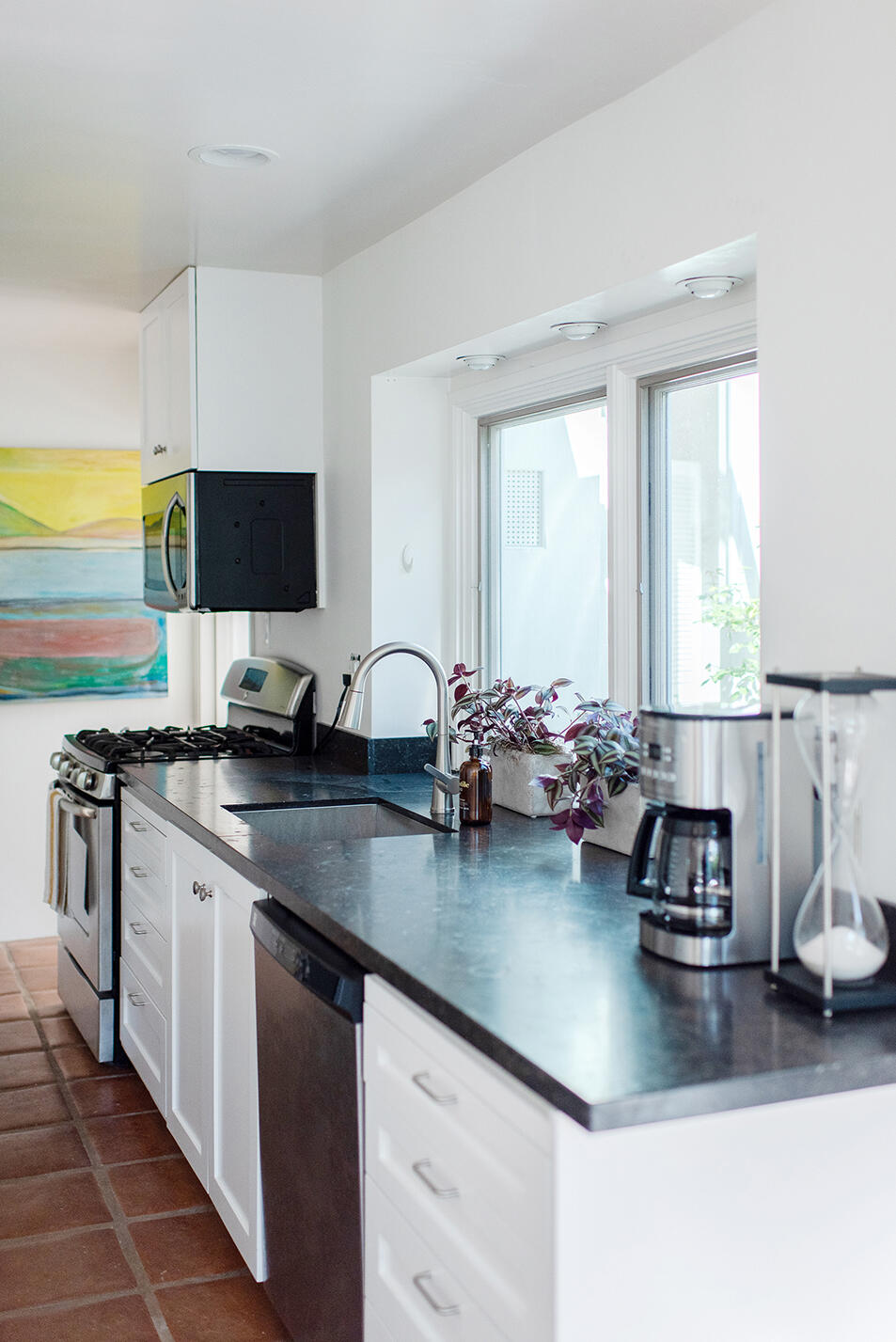 126 Loureyro Road Montecito, CA 93108 - Photo 11 of 46 a kitchen with a sink cabinets and wooden floor