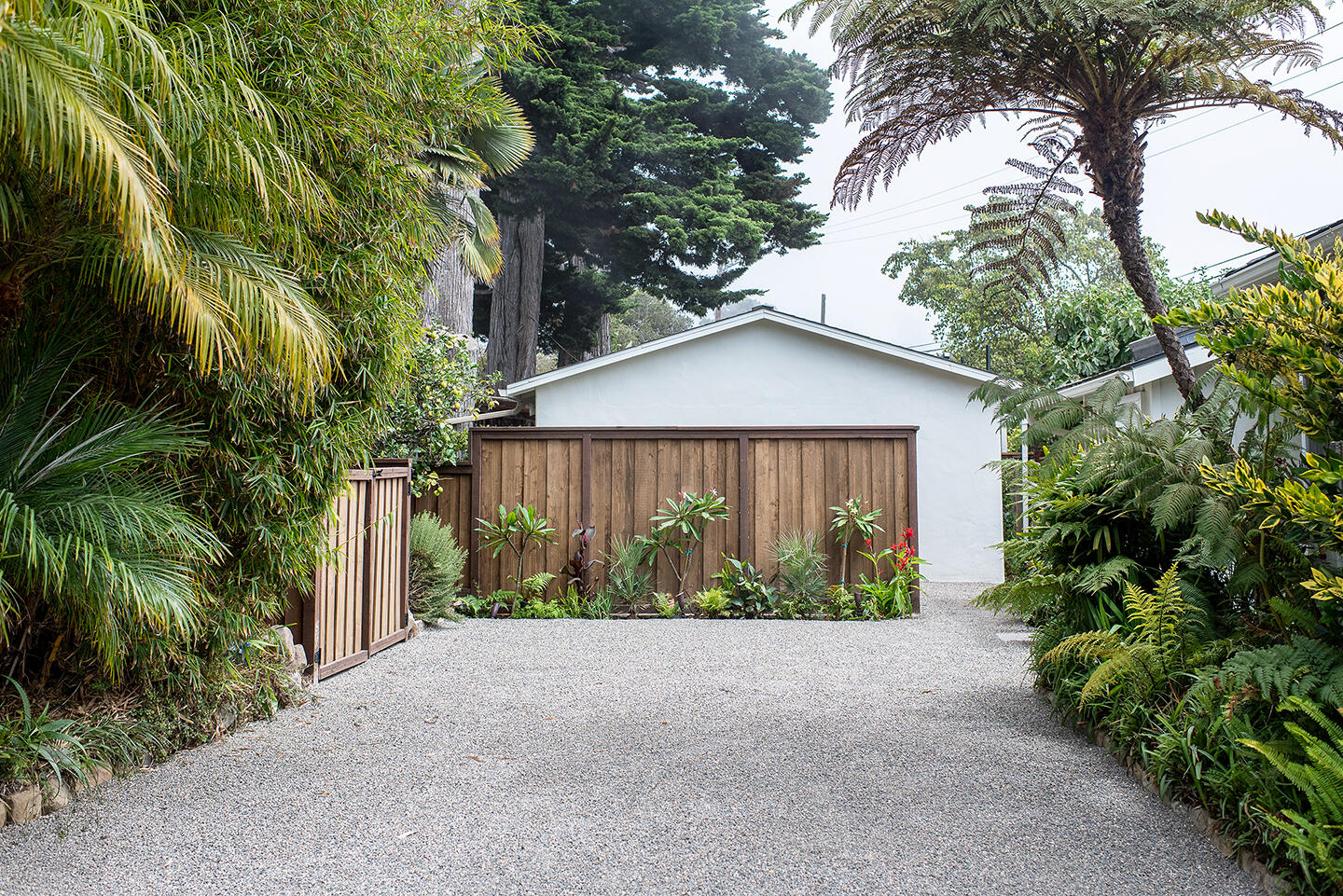 126 Loureyro Road Montecito, CA 93108 - Photo 23 of 46 a view of a house with a yard and potted plants