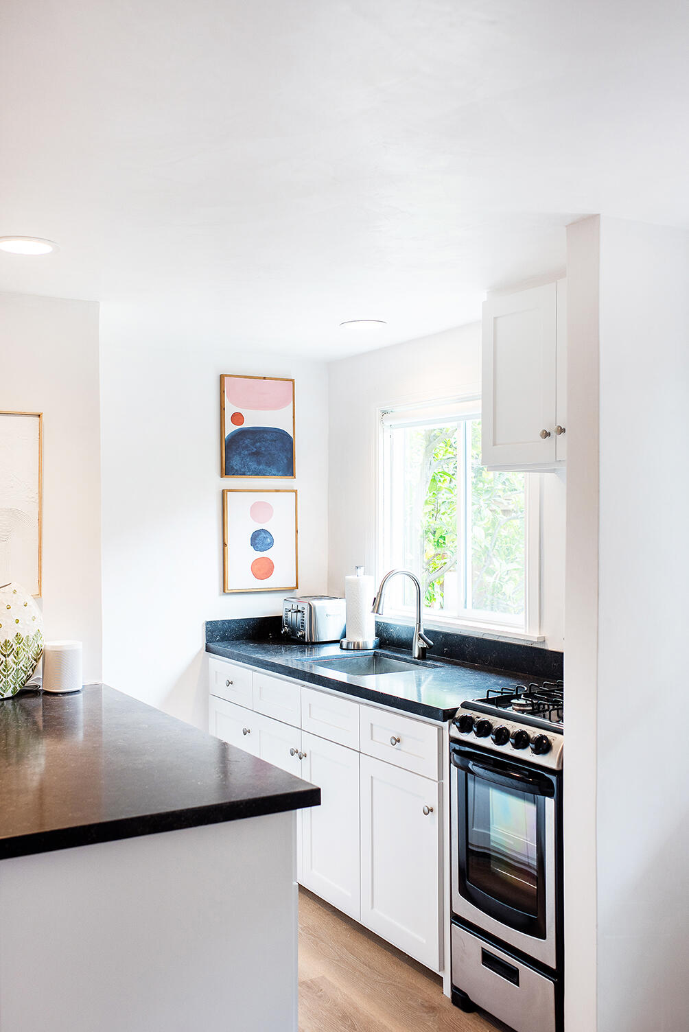 126 Loureyro Road Montecito, CA 93108 - Photo 29 of 46 a kitchen with stainless steel appliances granite countertop a sink and a stove