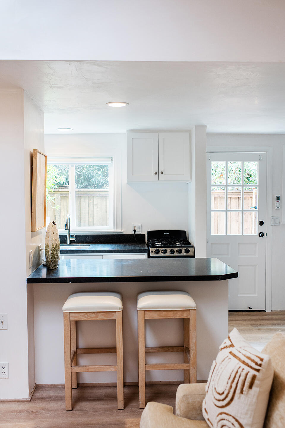 126 Loureyro Road Montecito, CA 93108 - Photo 34 of 46 a kitchen with a stove and a wooden cabinets