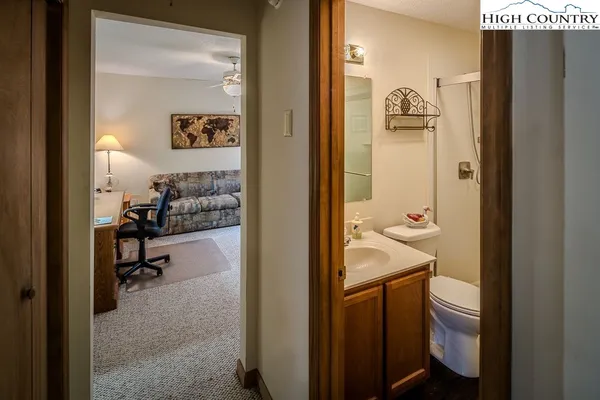 a view of a bathroom from the hallway