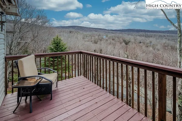 a view of balcony with wooden floor